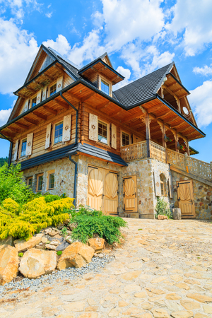 Traditional wooden mountain house on sunny summer day, Szczawnica, Pieniny Mountains, Polandの写真素材