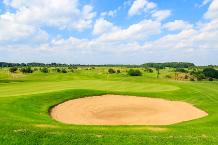 PACZULTOWICE GOLF CLUB, POLAND - AUG 9, 2014: golf course green play area in Paczultowice village on sunny summer day, Poland. Golfing is becoming a popular sport among wealthy people from Krakow.のeditorial素材