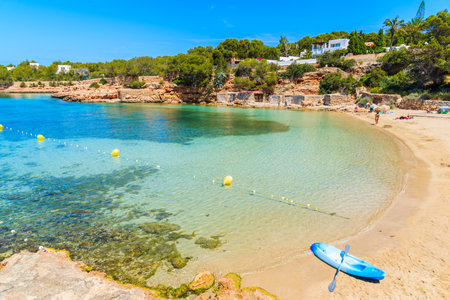 Blue kayak on beautiful Cala Gracioneta beach, Ibiza island, Spainのeditorial素材