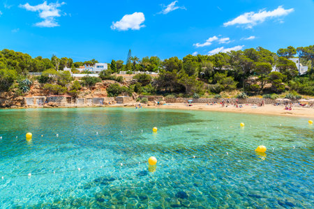 Turquoise crystal clear water of beautiful Cala Gracio beach, Ibiza island, Spainのeditorial素材