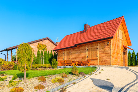 CHANCZA LAKE, POLAND - OCT 17, 2017: wooden house on shore of Chancza lake during autumn season, Poland.のeditorial素材