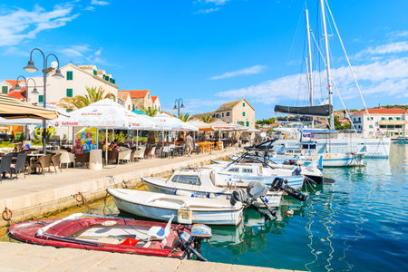 PRIMOSTEN, CROATIA - SEP 5, 2017: sailing and fishing boats anchoring in Primosten port, Dalmatia, Croatia.のeditorial素材