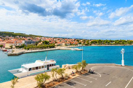 SUPETAR PORT, BRAC ISLAND - SEP 7, 2017: Pier in Supetar port with colorful houses and boats, Brac island, Croatia.のeditorial素材
