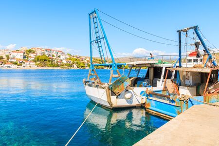 Fishing boats anchoring in Rogoznica port on sunny summer day, Dalmatia, Croatiaの写真素材