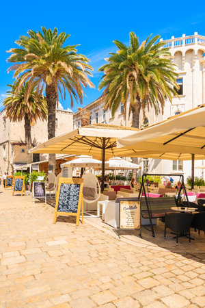 TROGIR TOWN, CROATIA - SEP 6, 2017: historical buildings and restaurants in old town of Trogir on sunny summer day, Dalmatia, Croatia.のeditorial素材
