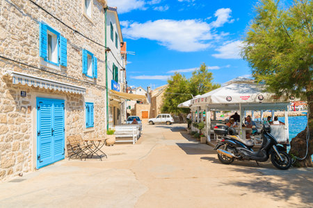 PRIMOSTEN TOWN, CROATIA - SEP 5, 2017: Local traditional restaurants on coastal promenade of Primosten old town, Dalmatia, Croatia.のeditorial素材