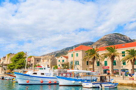 BOL PORT, BRAC ISLAND - SEP 8, 2017: Traditional fishing boats anchoring in Bol port, Brac island, Croatia.のeditorial素材