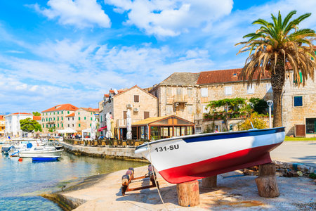 POSTIRA PORT, BRAC ISLAND - SEP 7, 2017: Fishing boats in Postira village with beautiful port, Brac island, Croatia.のeditorial素材