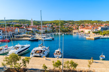 View of Supetar port with sailing boats and colorful houses on Brac island, Croatiaのeditorial素材