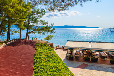 BOL, CROATIA - SEP 9, 2017: Coastal restaurant on beach in Bol near Zlatni Rat, Brac island, Croatia.のeditorial素材