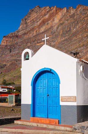 Blue door small traditional canary style church mountains view, Valle Gran Rey, La Gomera island, Spainの写真素材