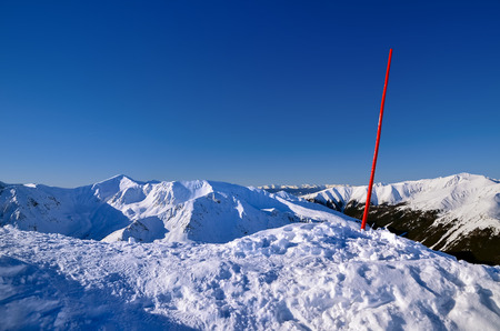 Red ski sign mountains winter snow landscape, High Tatras, Polandの写真素材