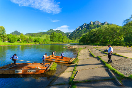 DUNAJEC RIVER, POLAND - MAY 19, 2013: Tourists raft on the Dunajec river, south of Poland. The rafting near the Slovakian border is very popular tourist attraction.のeditorial素材