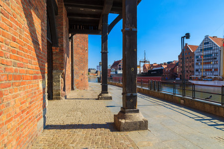 GDANSK, POLAND - JUN 8, 2013: shops and restaurants on riverside street of Gdansk port. Gdansk is a...