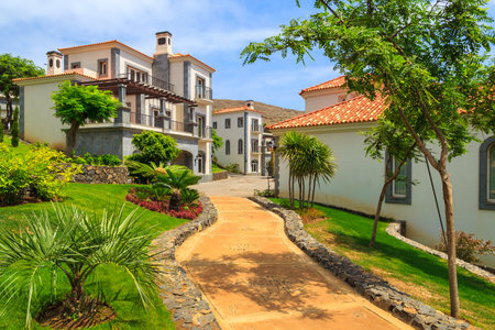 MADEIRA ISLAND, PORTUGAL - AUG 27, 2013: alley in gardens of luxury hotel on coast of Atlantic Ocean, Madeira island, Portugal.のeditorial素材