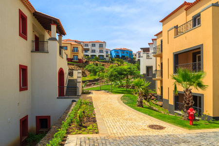 MADEIRA ISLAND, PORTUGAL - AUG 21, 2013: hotel apartments and gardens in luxury resort on southern coast of Madeira island. Many tourists spend holidays here due to wonderful climate.のeditorial素材