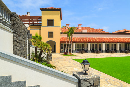 MADEIRA ISLAND, PORTUGAL - AUG 27, 2013: colonial buildings in luxury hotel on coast of Atlantic Ocean. Madeira island is famous for best hotels in Portugal and for climate of eternal spring.のeditorial素材