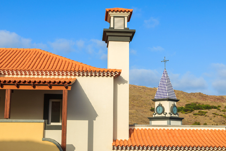 Church tower in Portuguese village on coast of Madeira islandの写真素材