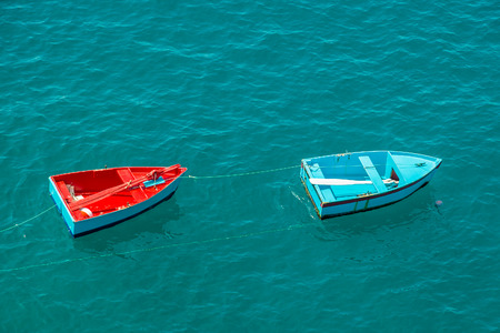 Two small fishing boats on sea, Madeira island, Portugalの写真素材