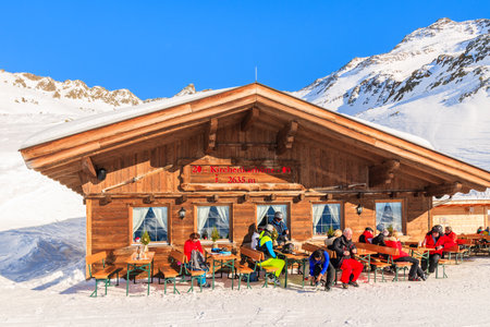 OBERGURGL SKI AREA, AUSTRIA - JAN 31, 2018: Skiers dining in mountain hut restaurant in Obergurgl ski area, Tirol, Austria.のeditorial素材