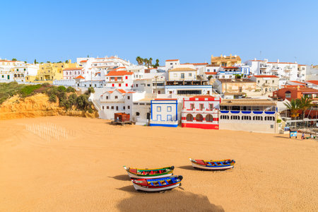 Beach with fishing boats in Carvoeiro town, Algarve, Portugalのeditorial素材