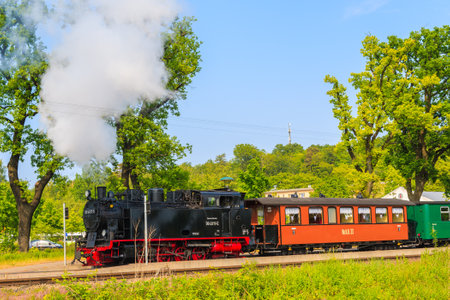 SELLIN STATION, RUEGEN ISLAND - JUN 1, 2018: Historical steam train entering station, Baltic Sea, Germany. Ruegen is popular tourist destination because of its diverse landscape and coastline.のeditorial素材