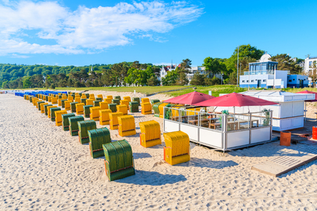 Traditional wicker chairs on sandy beach in Binz summer resort, Ruegen island, Baltic Sea, Germanyの写真素材