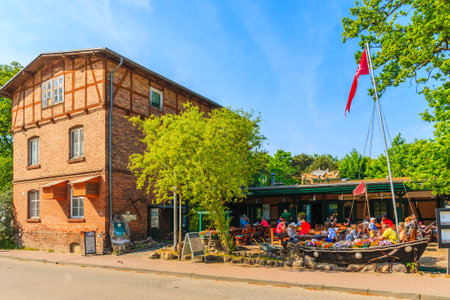 BAABE TOWN, RUEGEN ISLAND - MAY 28, 2018: People dining in restaurant in Baabe summer resort town, Baltic Sea, Germany. Rugen is popular tourist destination due to resort architecture.のeditorial素材