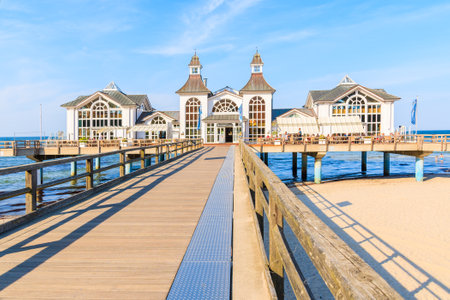SELLIN, RUEGEN ISLAND - MAY 28, 2018: Pier with historic building on sandy beach in Ostseebad Sellin on Baltic Sea coast, Germany. Ruegen is popular tourist destination because of its architecture.のeditorial素材