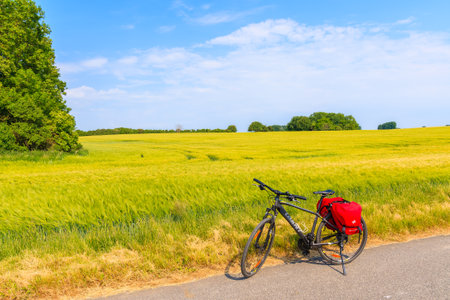 GROSS STRESOW, RUEGEN ISLAND - JUN 1, 2018: Bicycle on route near Gross Stresow village in countryside spring landscape, Ruegen island, Baltic Sea, Germany. Ruegen is cycling paradise.のeditorial素材
