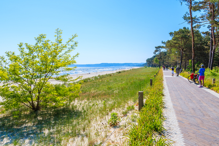 Walking path along sandy beach in Prora town, Ruegen island, Baltic Sea, Germanyの写真素材