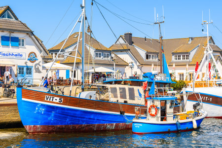 VITTE PORT, HIDDENSEE ISLAND - MAY 30, 2018: Fishing boats in Vitte port on sunny beautiful day. It...