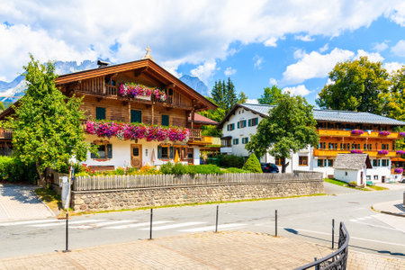 Traditional alpine houses in village of Going am Wilden Kaiser on beautiful sunny summer day, Tirol, Austriaのeditorial素材