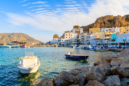Boats in beautiful Pigadia fishing port at sunset time, Karpathos island, Greeceのeditorial素材