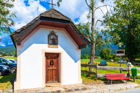 Small chapel along road in Going am Wilden Kaiser village on beautiful sunny summer day, Tirol, Austriaのeditorial素材