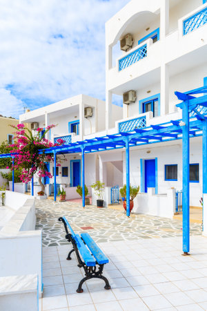 Typical whitewashed houses with blue doors and flowers in Ammopi village, Karpathos island, Greeceのeditorial素材