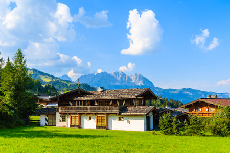 Typical alpine house in countryside landscape near Kitzbuhel town, Tirol, Austriaのeditorial素材
