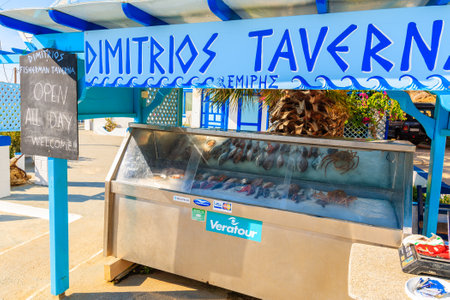FINIKI PORT, KARPATHOS ISLAND - SEP 25, 2018: Stand presenting fresh fish to eat in taverna restaurant in village on coast of Karpathos island, Greece.のeditorial素材
