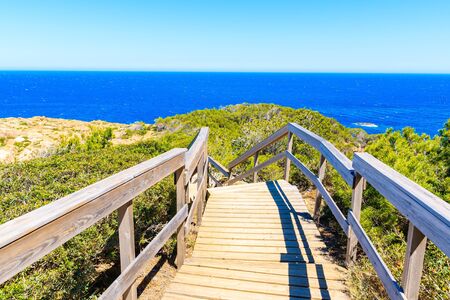 Coastal wooden walkway to sea near Sa Tuna village, Costa Brava, Spain