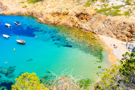 Boats in beautiful sea bay with beach near Sa Tuna village, Costa Brava, Spainのeditorial素材