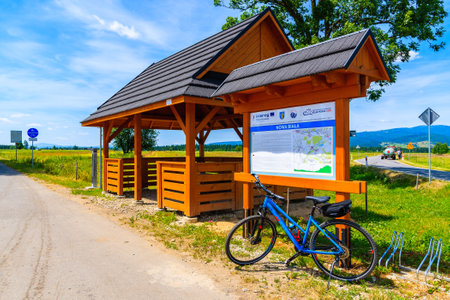 TATRA MOUNTAINS, POLAND - JUN 29, 2019: Bike parking in front of map with cycling ways in Tatra Mountains, Poland.のeditorial素材