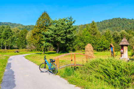 VELO DUNAJEC CYCLING WAY, SEP 15, 2019: Bicycle parking on roadside of Dunajec cycling path near Nowy Sacz, Poland.のeditorial素材