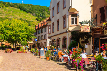 ALSACE WINE REGION, FRANCE - SEP 19, 2019: People dining in typical restaurant in Kaysersberg village which is located on Alsatian Wine Route, France.のeditorial素材