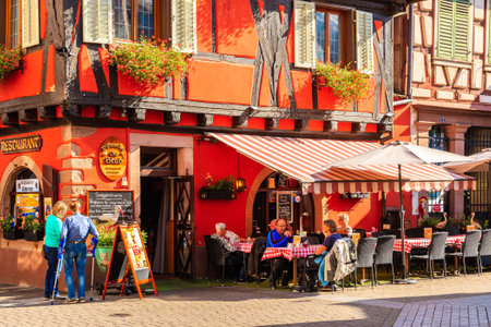 ALSACE WINE REGION, FRANCE - SEP 20, 2019: People dining in restaurant on street of Ribeauville village which is located on Alsatian Wine Route, France.のeditorial素材