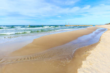 Beautiful white sand beach and blue sea near Kolobrzeg, Baltic Sea coast, Polandの写真素材