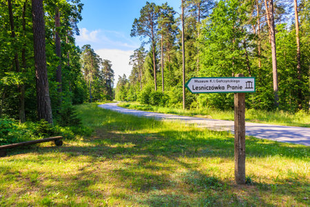 PUSZCZA PISKA, POLAND - JUN 25, 2020: Sign along forest road to forester house in Pranie village near lake Nidzkie. This house was home to famous Polish writer Konstanty Ildefons Galczynski, Mazury Lake District.のeditorial素材