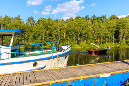LAKE BELDANY, POLAND - JUN 28, 2020: Sailing boat on Lake Beldany near Ruciane Nida, Masurian Lakes, Poland. This region is popular holiday destination for people of Warsaw city.のeditorial素材