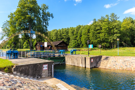 "Sluza Karwik" which translation is "Sluice in Karwik village" connecting Sniardwy Lake with Ros Lake, important for sailing on Masurian Lakes, Polandのeditorial素材