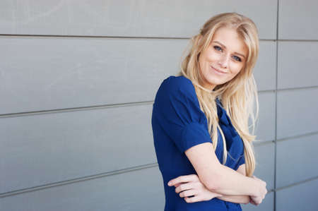 A portrait of a young professional attractive woman standing outsideの写真素材