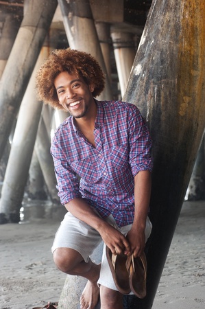 handsome young African American man at the beachの写真素材